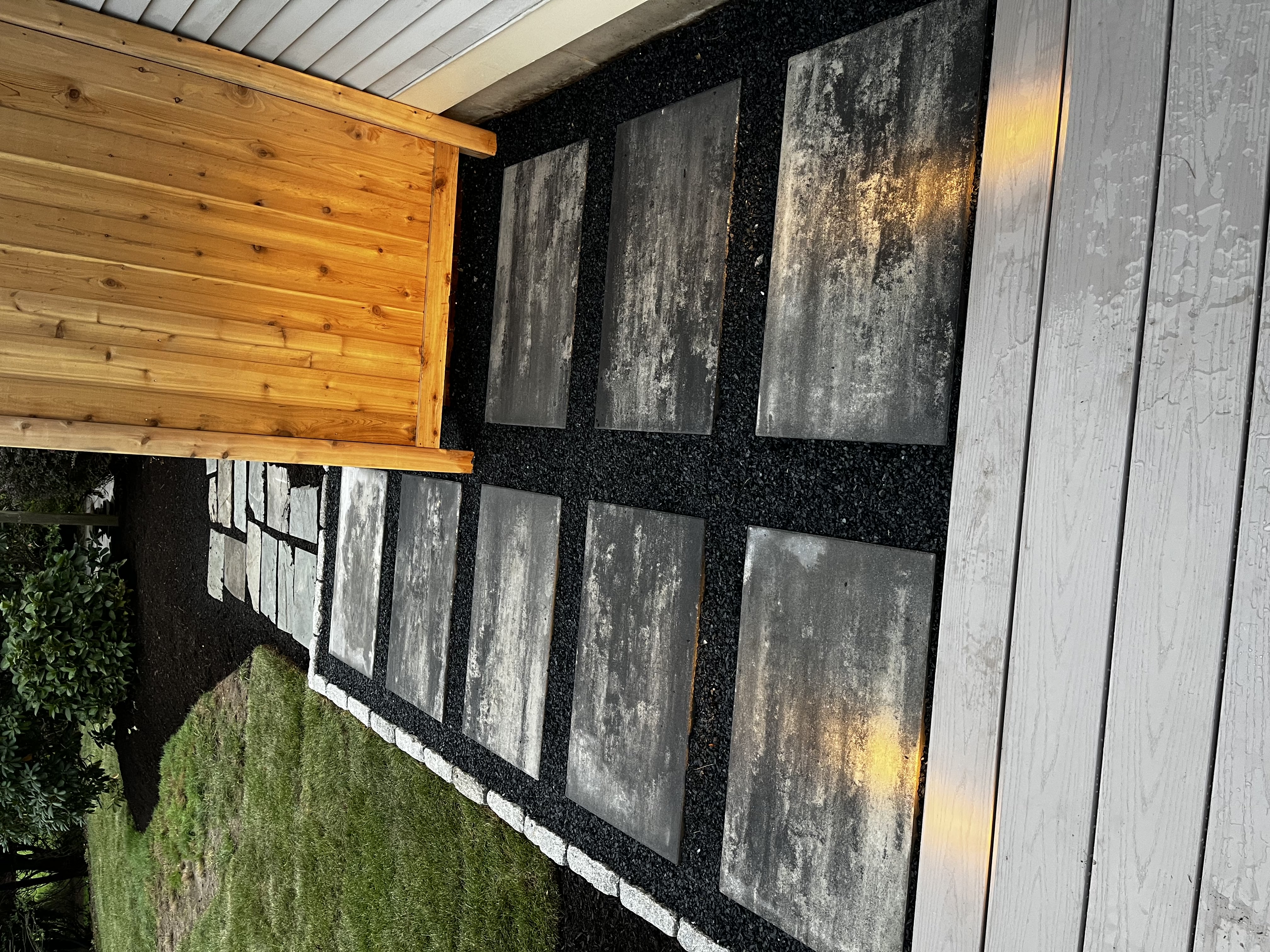 Custom retaining wall with integrated landscape lighting