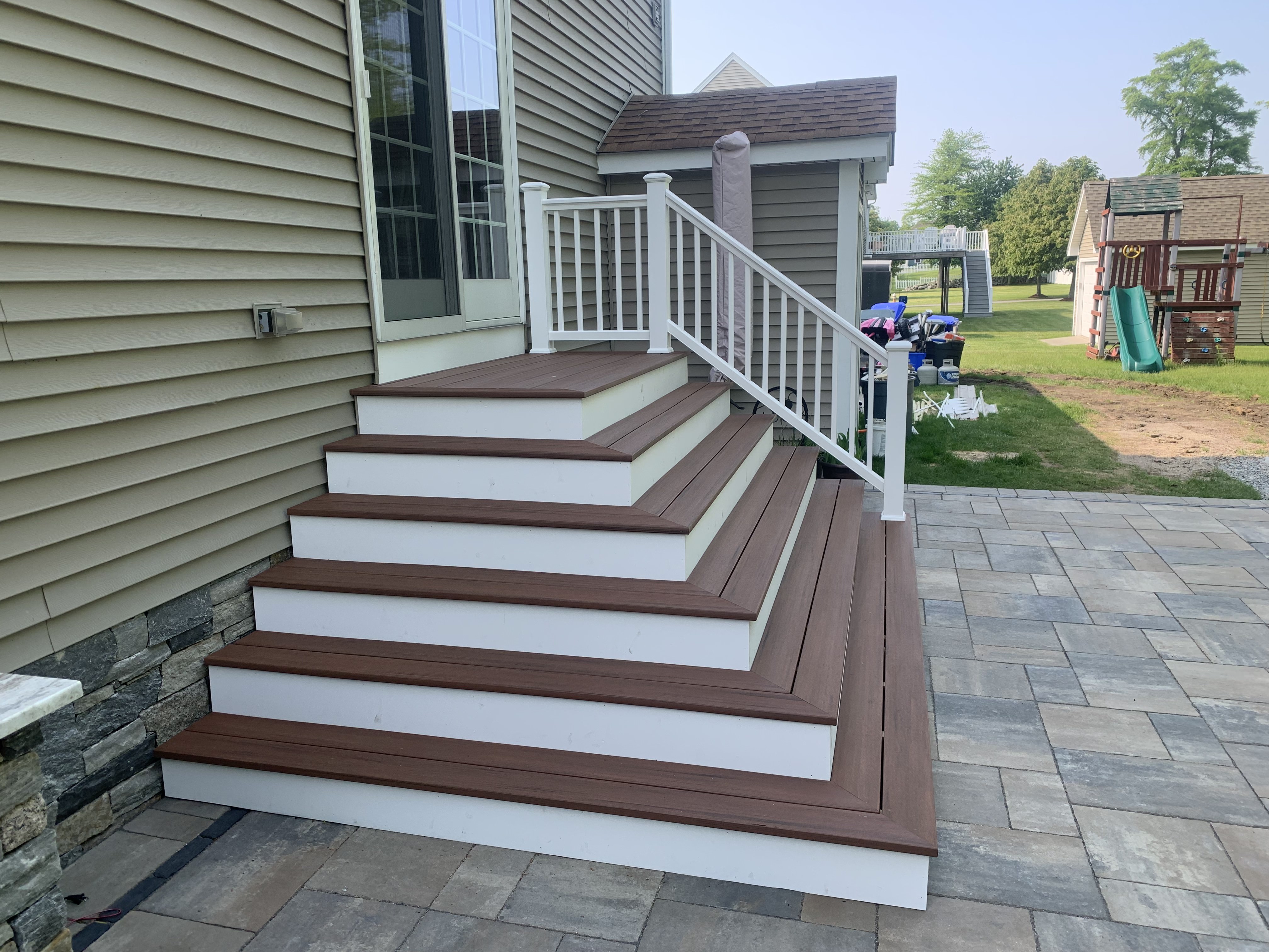 Fieldstone retaining wall along sloped Rhode Island property