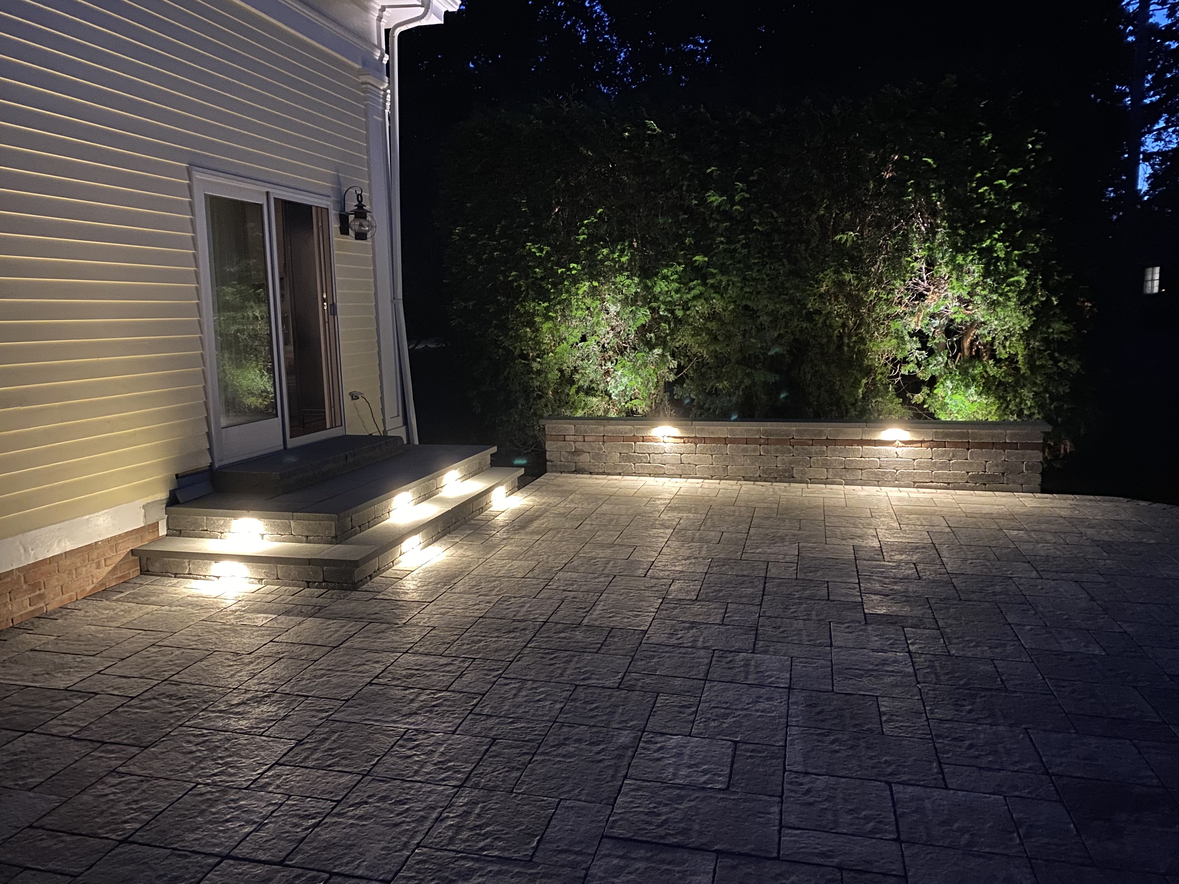 Outdoor living space with stone veneer and seating area