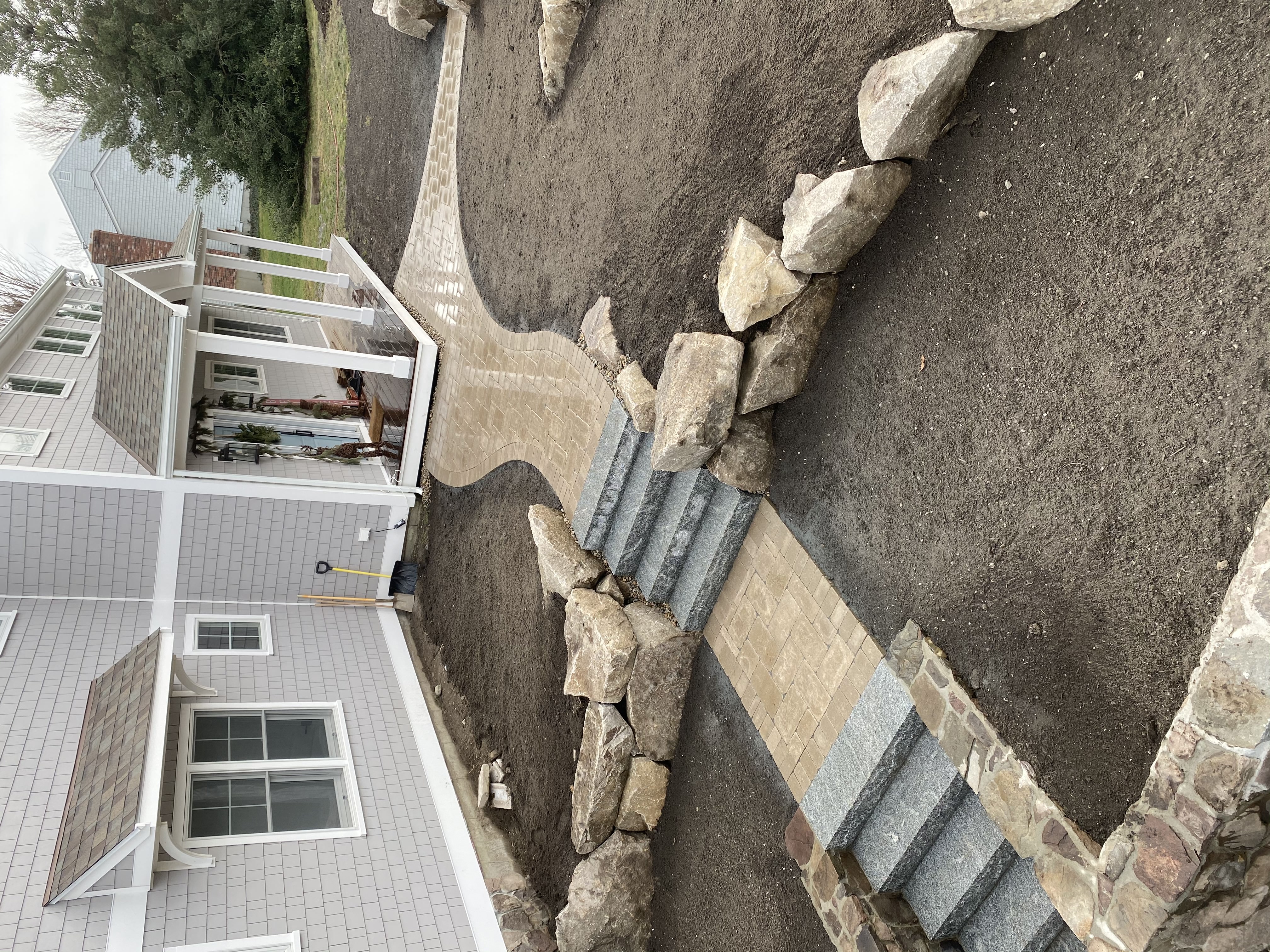 Paver driveway extension with decorative border