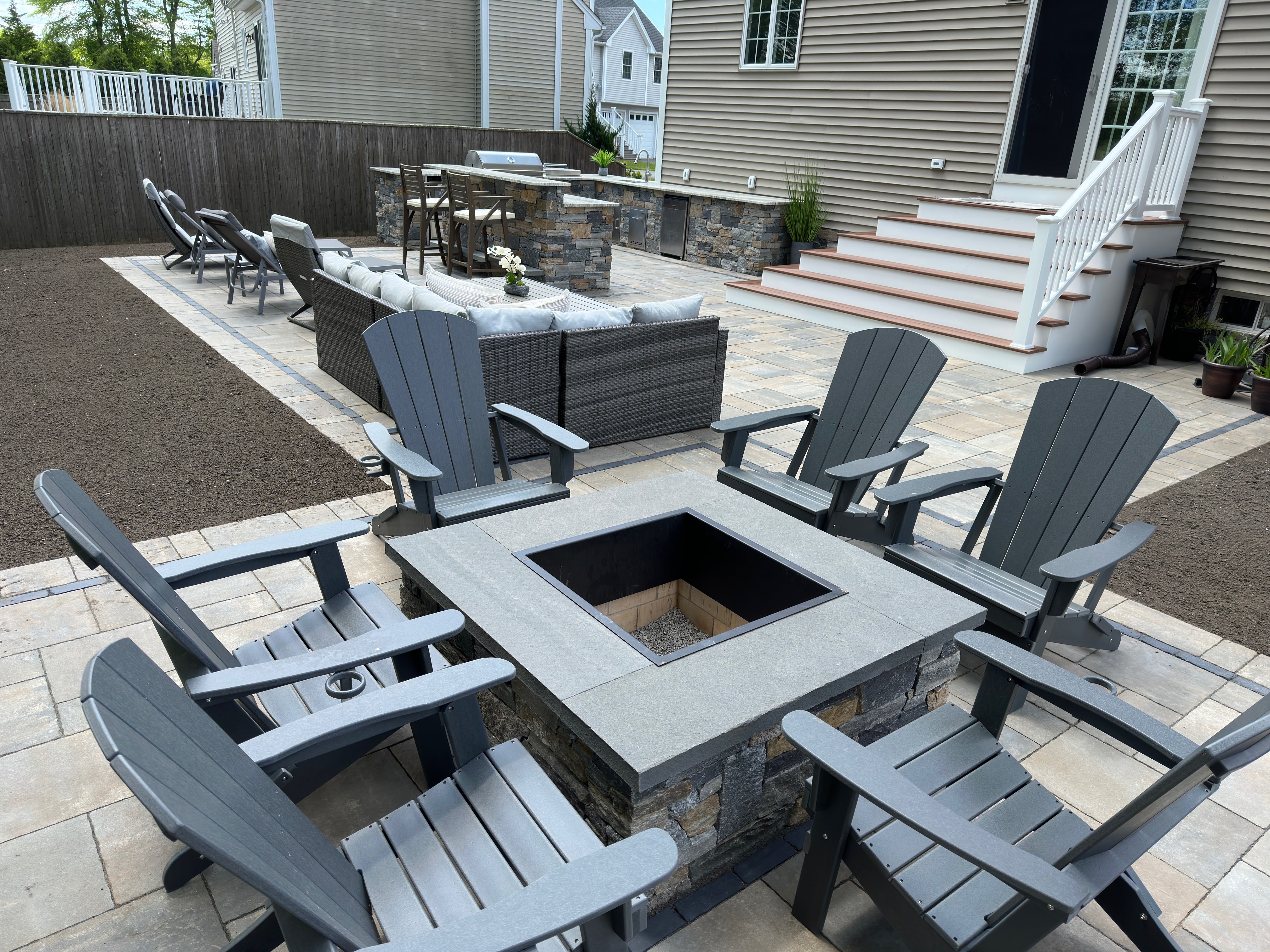 Backyard transformation with patio and retaining walls