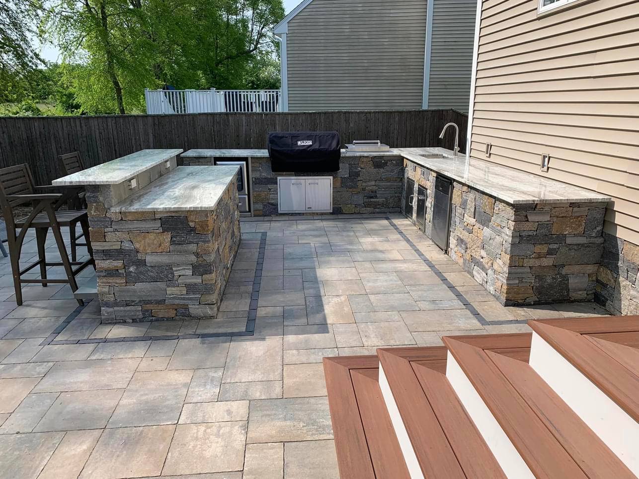 Custom stone wall with cap stones in Jamestown