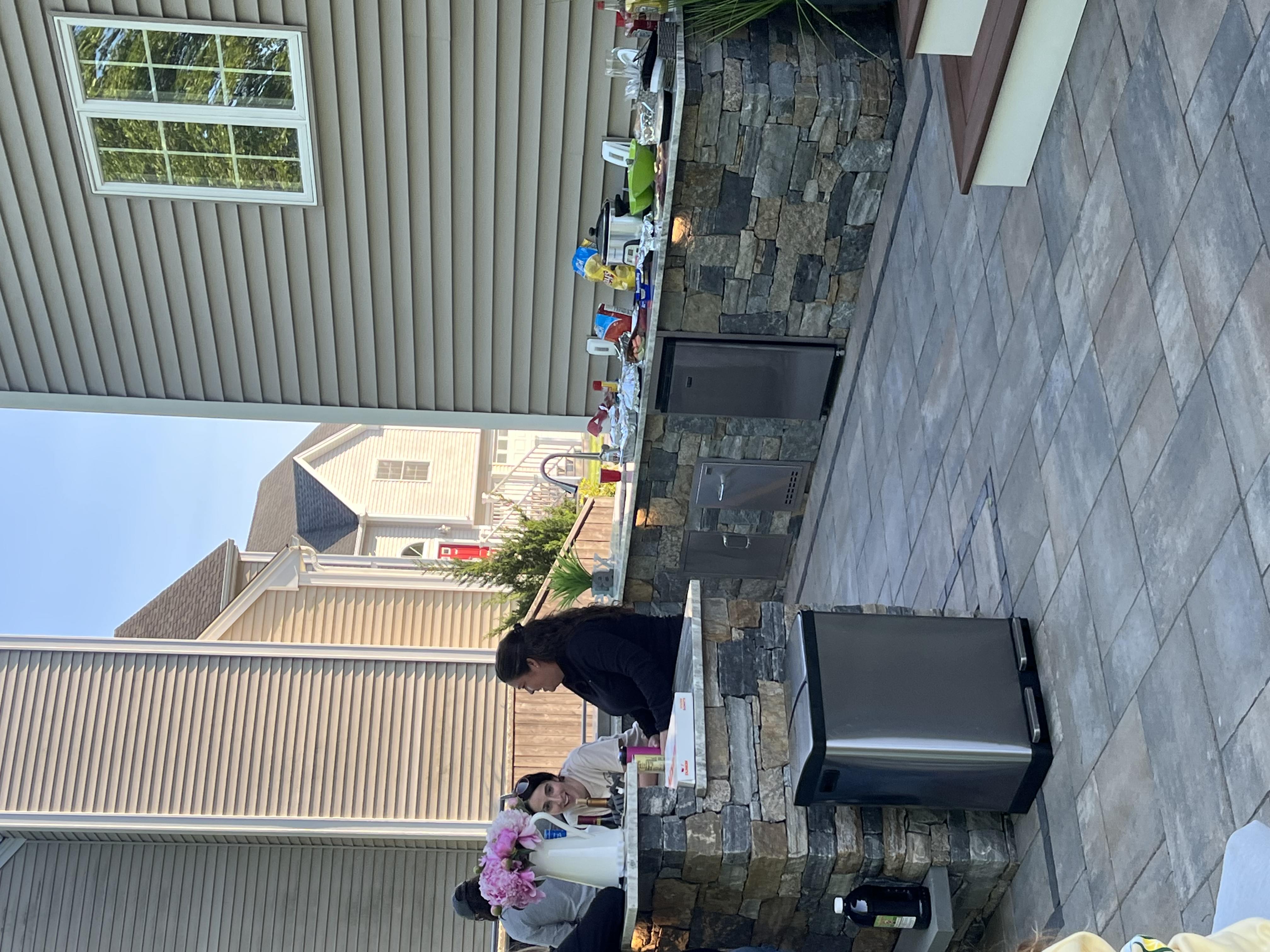 Outdoor kitchen area with granite countertops