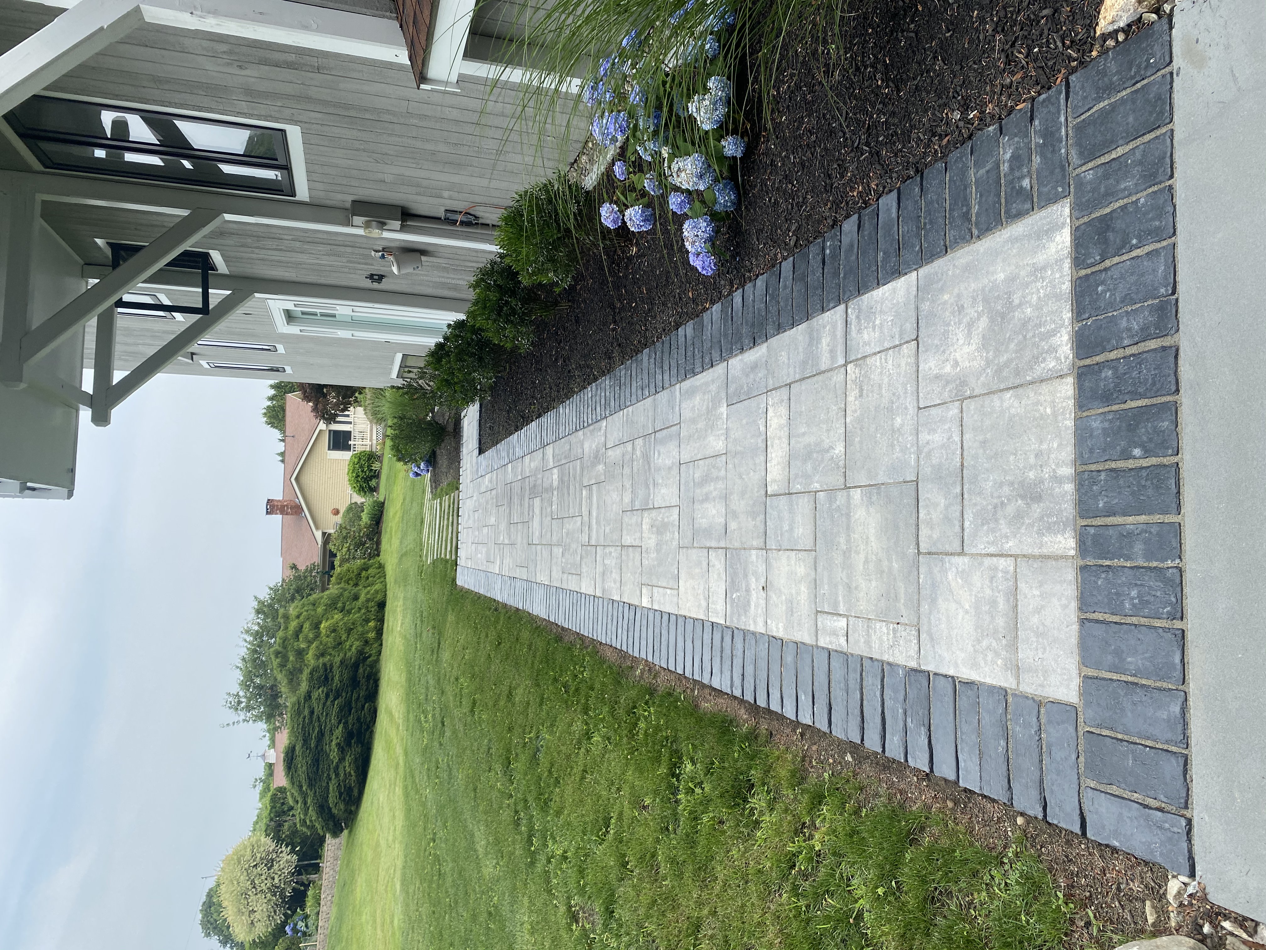 Front entrance walkway with cobblestone accents